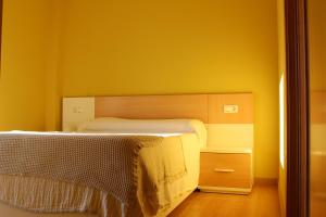 Postel nebo postele na pokoji v ubytování O Faro de Corrubedo