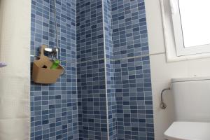 Koupelna v ubytování O Faro de Corrubedo + 18 fotografií