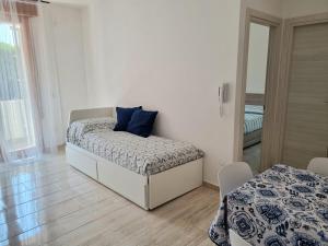 Postel nebo postele na pokoji v ubytování Relax Rosolina Mare