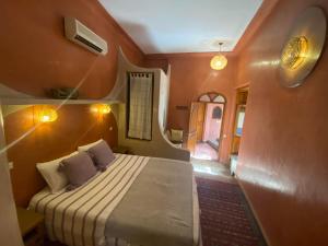 Postel nebo postele na pokoji v ubytování Riad Sabah