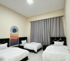 Giường trong phòng chung tại Lunar Beach Hostel