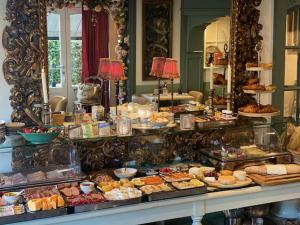 a buffet with many different types of food on display at Hotel Villa Verdi in Knokke-Heist