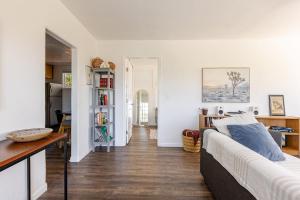 a living room with a couch and a table at Serene and beautiful hillside retreat in Glendale