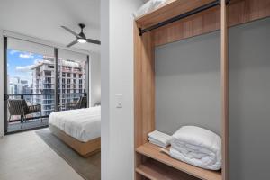 a bedroom with a bed and a window with a view at New Luxury Apartment at Downtown Miami in Miami +23 photos