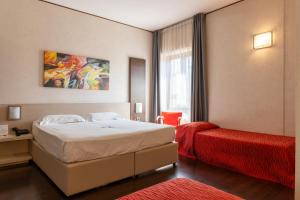 Postel nebo postele na pokoji v ubytování Hotel Valentino + 37 fotografií