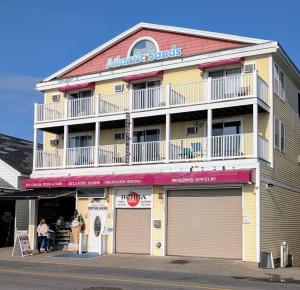 a building with a sign that reads anchorage sands at Atlantic Sands in Hampton
