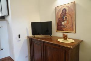 TV a/nebo společenská místnost v ubytování il Monastero di Bevagna