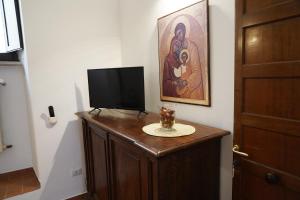 TV a/nebo společenská místnost v ubytování il Monastero di Bevagna