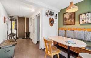 a dining room with a table and chairs at Holiday Home Herschdorf Lange-Berg-Str in Herschdorf
