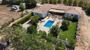 an aerial view of a house with a swimming pool at Finca El Romeral in Alpera