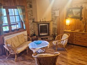 Posedenie v ubytovaní Ferienhaus Marianna am See mit gratis Sauna, Ruderboot, Kajak & WLAN