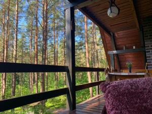 Balkón alebo terasa v ubytovaní Ferienhaus Marianna am See mit gratis Sauna, Ruderboot, Kajak & WLAN
