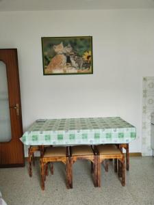 a table that is sitting in a room at Piccolo appartamento in montagna in Serina +6 photos