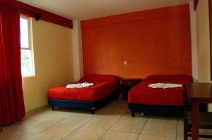 Postel nebo postele na pokoji v ubytování Hotel Casa Rus