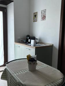 a small kitchen with a table with a counter top at La Casetta in Grotte di Castro