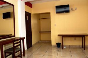 TV a/nebo společenská místnost v ubytování Hotel Casa Rus