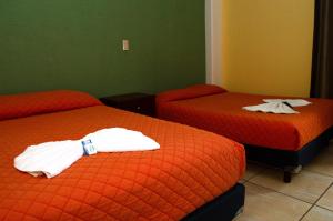 Postel nebo postele na pokoji v ubytování Hotel Casa Rus