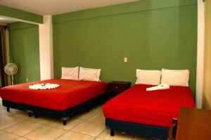 Postel nebo postele na pokoji v ubytování Hotel Casa Rus