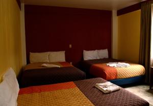 Postel nebo postele na pokoji v ubytování Hotel Casa Rus