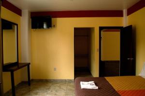 Postel nebo postele na pokoji v ubytování Hotel Casa Rus