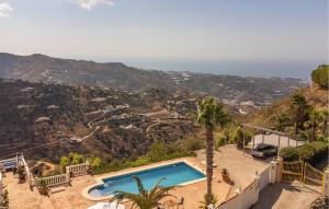 een villa met een zwembad op de top van een berg bij 1 Bedroom Gorgeous Home In Arenas in Arenas