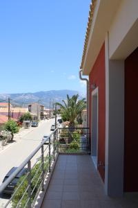 a balcony with a view of a street at Modern Living Kefalonia in Lakíthra