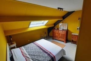a bedroom with a large bed and a window at L'étape Saint-Joseph in Brunehaut