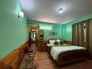 Postel nebo postele na pokoji v ubytování Hotel Geetanjali