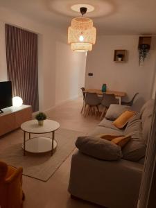 a living room with a couch and a table at Paseo Marítimo Aguadulce in Aguadulce