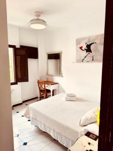 Łóżko lub łóżka w pokoju w obiekcie Hotelito Suecia