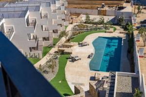an aerial view of a building with a swimming pool at Best view rooftop with heated jacuzzi in Cabo San Lucas