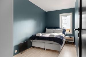 En eller flere senger på et rom på ARCTIC HOMES - Premium Aurora Apartment