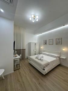 Postel nebo postele na pokoji v ubytování Center Rooms La Spezia + 24 fotografií