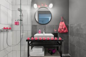 a bathroom with a sink and a mirror at Moxy La Ciotat in La Ciotat
