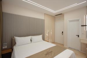 Postelja oz. postelje v sobi nastanitve Downtown Hotel
