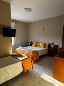 Ένα ή περισσότερα κρεβάτια σε δωμάτιο στο Nova Costa B&B