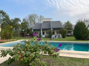 a house with a swimming pool in the yard at Costa Luna Federacion in Federación
