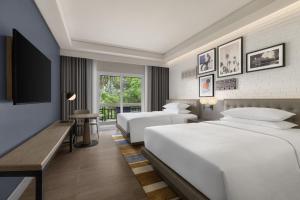 Voodi või voodid majutusasutuse Four Points by Sheraton Palawan Puerto Princesa toas
