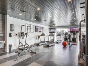 a gym with several treadmills and cardio machines at Gorgeous Central City 2BD 2BA in Salt Lake City