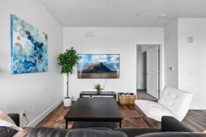 a living room with a couch and a table at Gorgeous Central City 2BD 2BA in Salt Lake City +41 photos