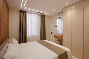 Postelja oz. postelje v sobi nastanitve Downtown Hotel
