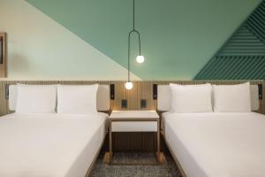 Katil atau katil-katil dalam bilik di Courtyard by Marriott Curacao