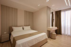Postelja oz. postelje v sobi nastanitve Downtown Hotel