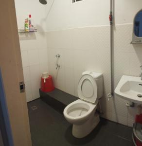 a bathroom with a toilet and a sink at Santai Homestay 2 in Kota Kinabalu