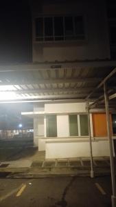 a parking lot with a building with a parking lot at Santai Homestay 2 in Kota Kinabalu