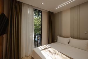 Postelja oz. postelje v sobi nastanitve Downtown Hotel
