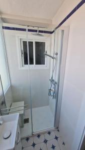 a bathroom with a shower and a toilet and a sink at Ardhraubu Villa, Terra Cotta & Very Close to Sea in La Cala de Mijas +30 photos
