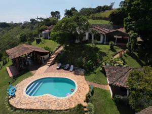 an aerial view of a house with a swimming pool at La Villa The View in Pance