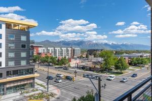 a view of a city with mountains in the background at Luxury Apt 6th floor - King Bed Gym Prkg Pool NEW in Salt Lake City