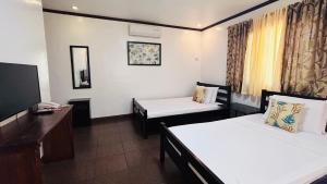 Postel nebo postele na pokoji v ubytování Luxor Resort